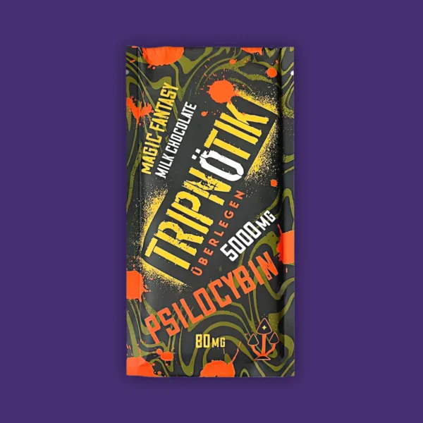 A Tripnotik Magic Fantasy bar of milk chocolate embellished with magical orange flowers. | Mush.City